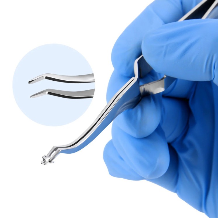 Pinza per posizionare tubi molari